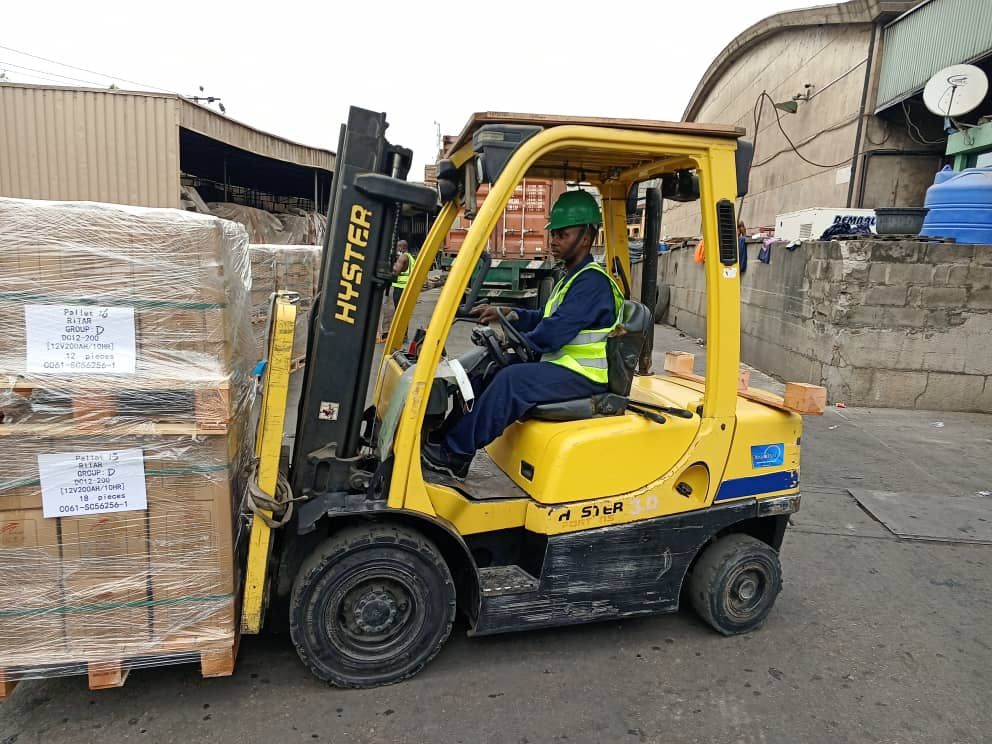 Forklift operator managing pallets in the yard