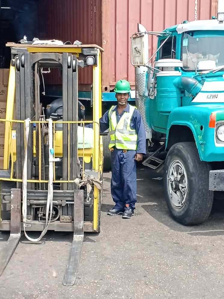 Forklift loading a delivery truck